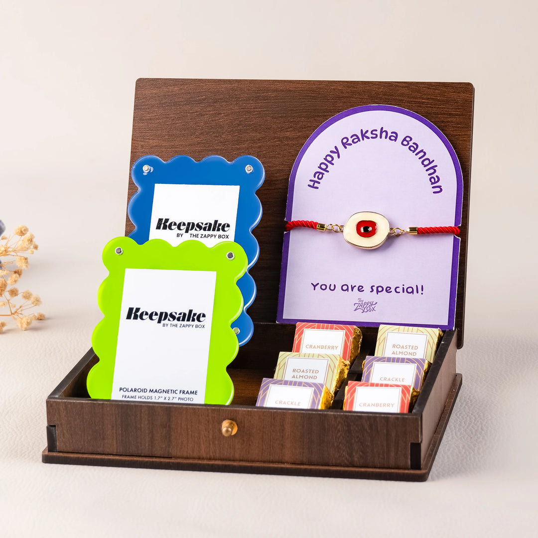 evil eye rakhi with chocolates and photo frame hamper