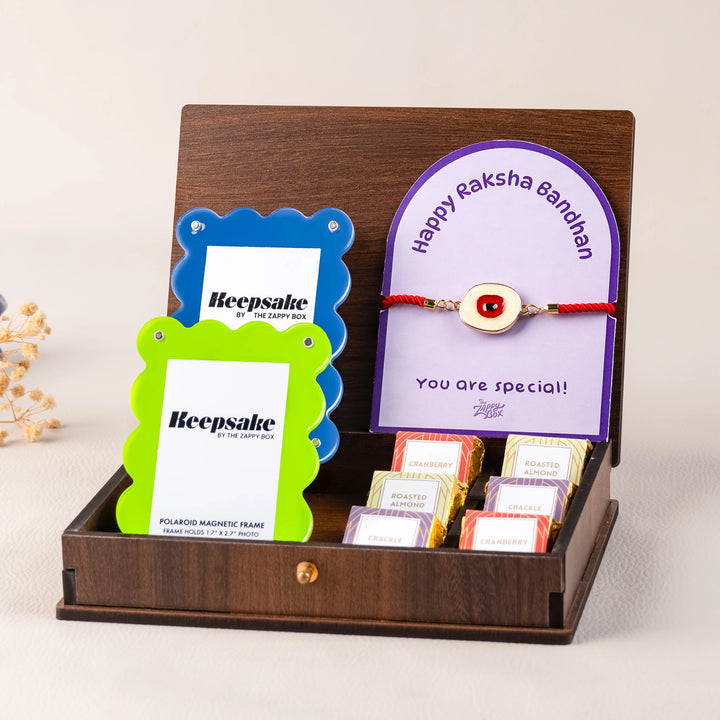 evil eye rakhi with chocolates and photo frame hamper