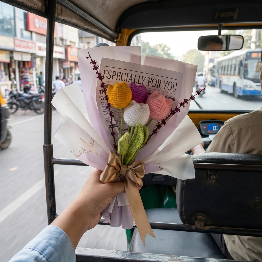 Bouquet of knitted flowers held by a person 
