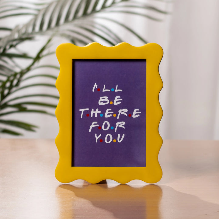 Yellow scalloped frame, with violet and white text inspired by "Friends" television sitcom