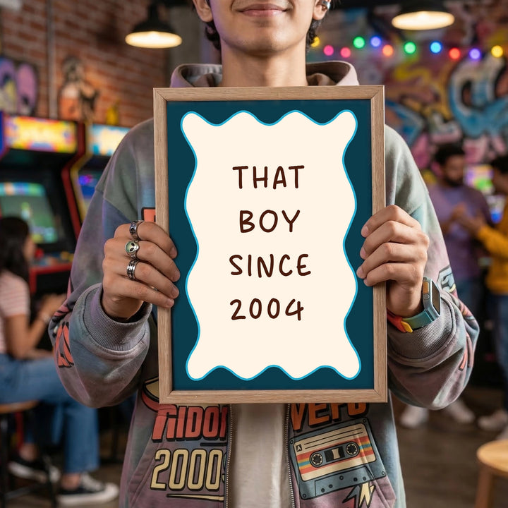 A boy holding this Iconic since frame with custom birth yea, Blue and white scalloped design, and "That Boy Since birth year" written