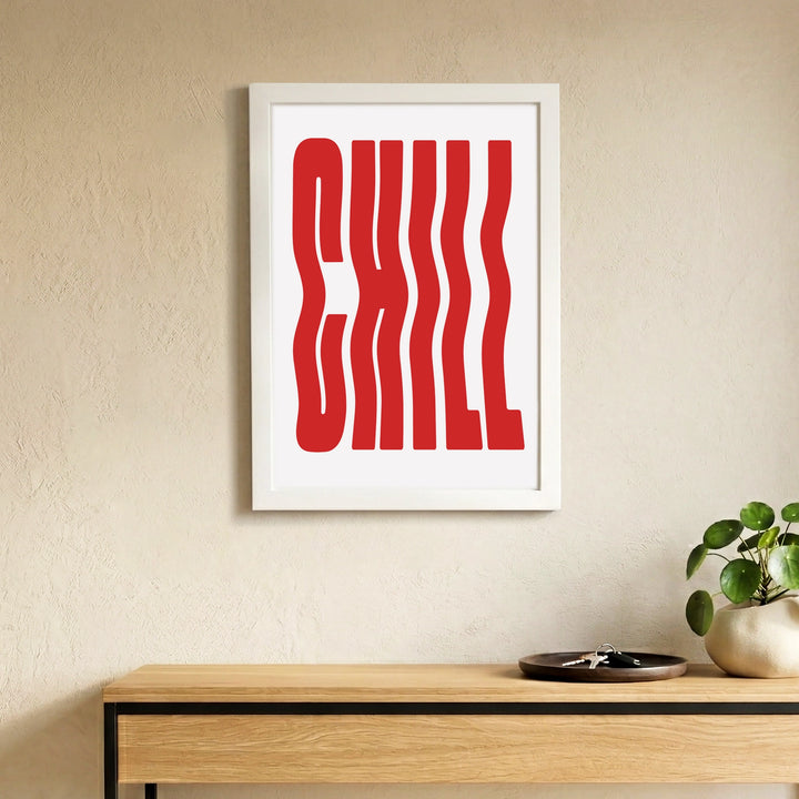 Red and white CHILL wall art written in weavy style, white frame, mounted on the wall  
