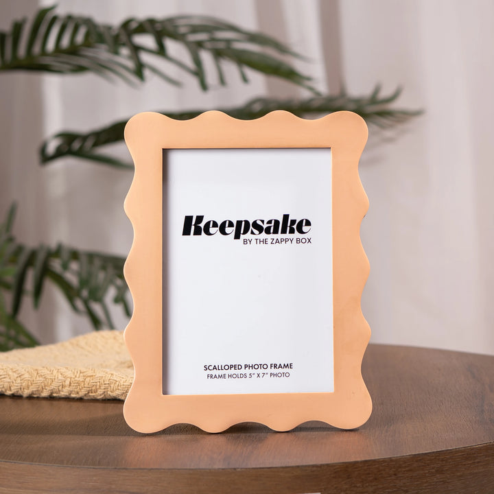 Scalloped Aesthetic Peach Frame placed on the table, wooden frame with matte resin finish 