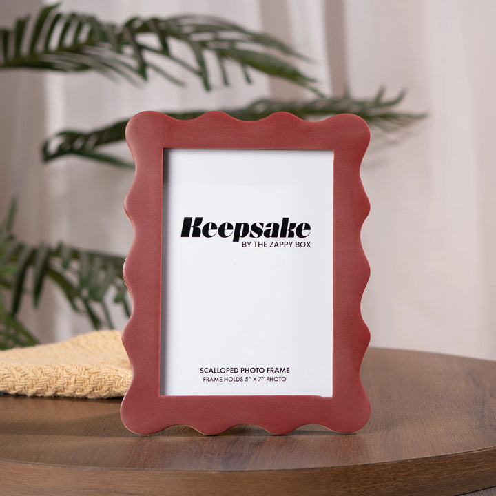 Scalloped Aesthetic Maroon Frame placed on the table, wooden frame with matte resin finish 