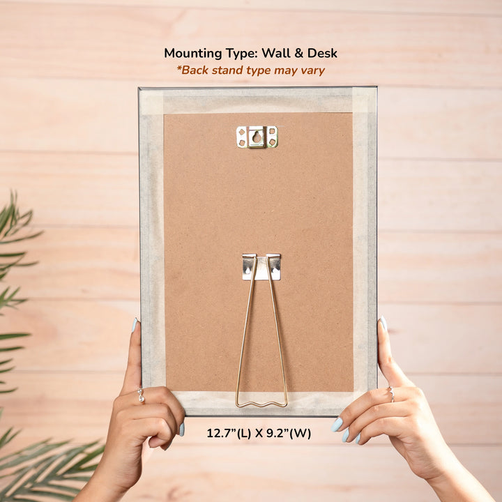 Backside of the frame showing wall hook and desk stand mount