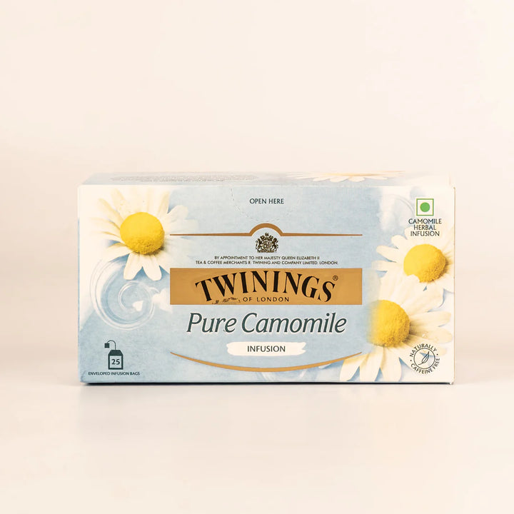 Box of Twinings Pure Camomile tea on a light beige background